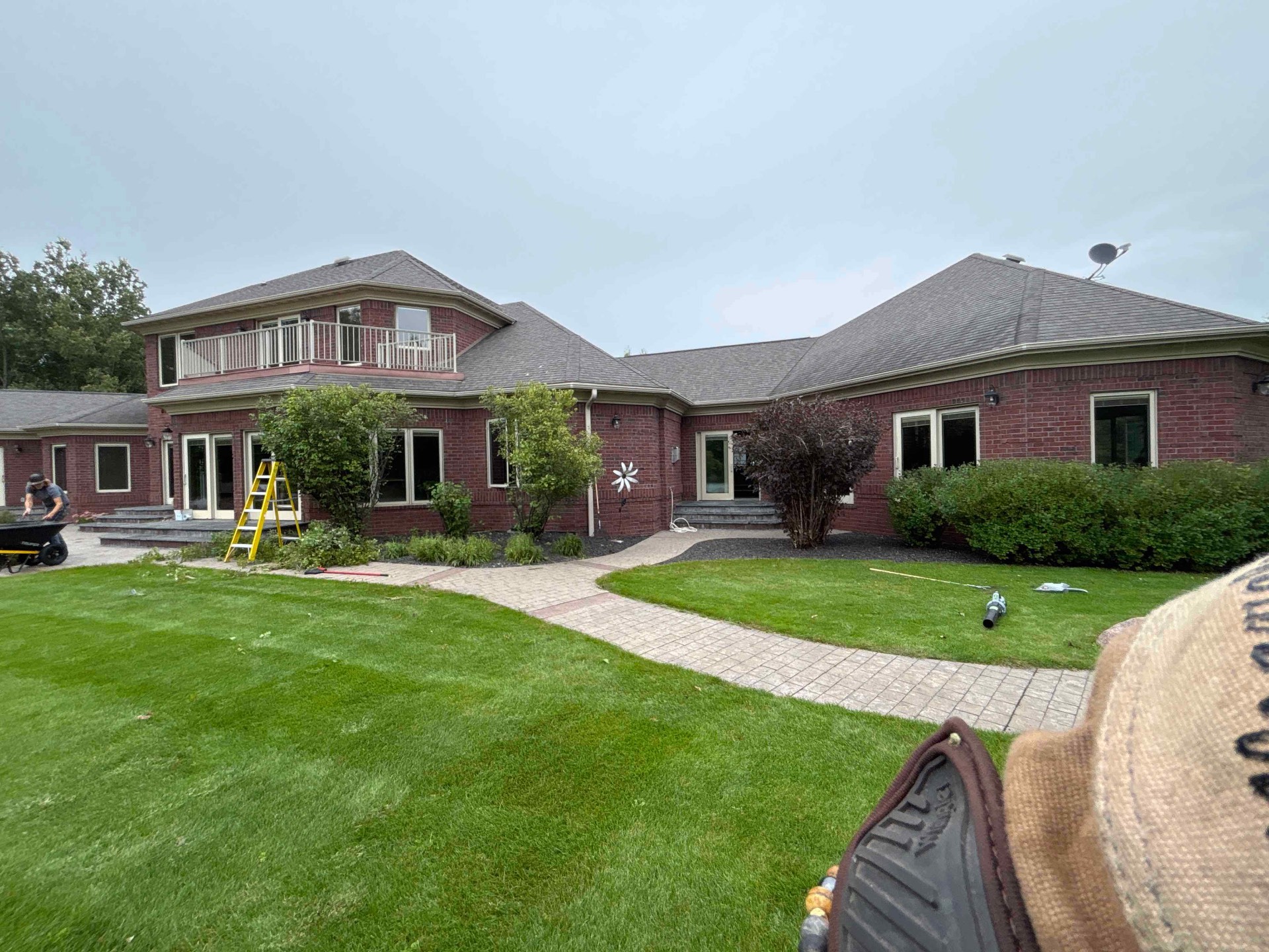 No Plan LLC crew completing landscape-bed preparation and installation at a Central Wisconsin residence